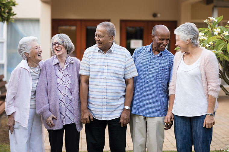 candid shot of group of senior friends laughing together simple retirement plan our core principles germantown wi