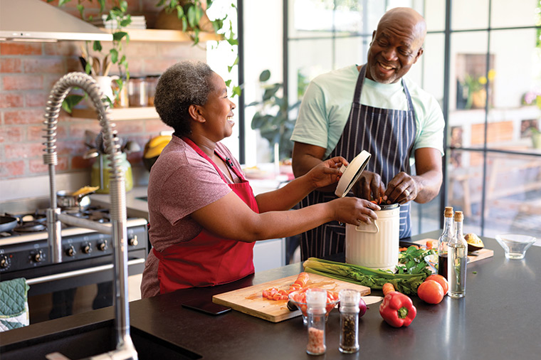 couple cooking in the kitchen together keys to successful retirement strategies germantown wi